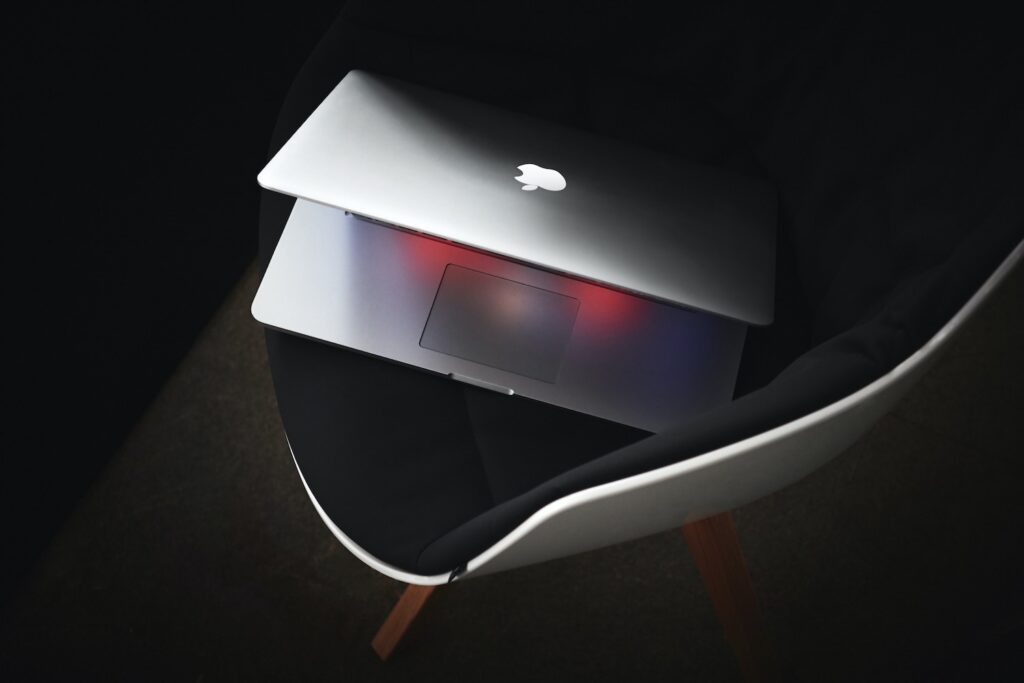 MacBook slightly open, viewed from above – minimalist visual reinforcing article on strategy-driven, purpose-led web design.