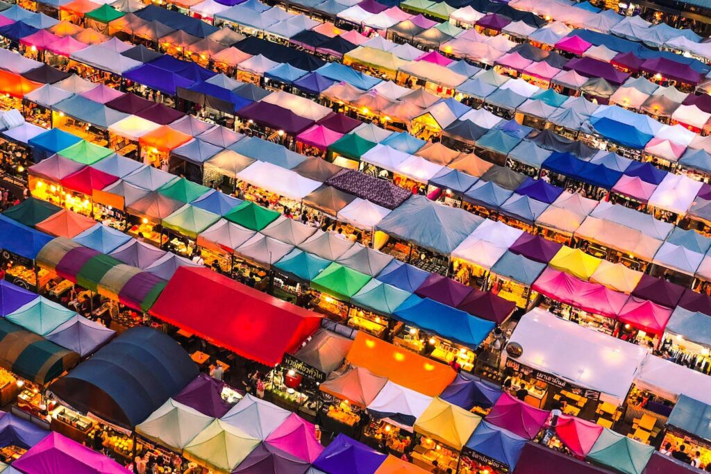 Overhead view of a large, bustling marketplace – metaphor for visibility, competition, and the need for digital marketing beyond web design.