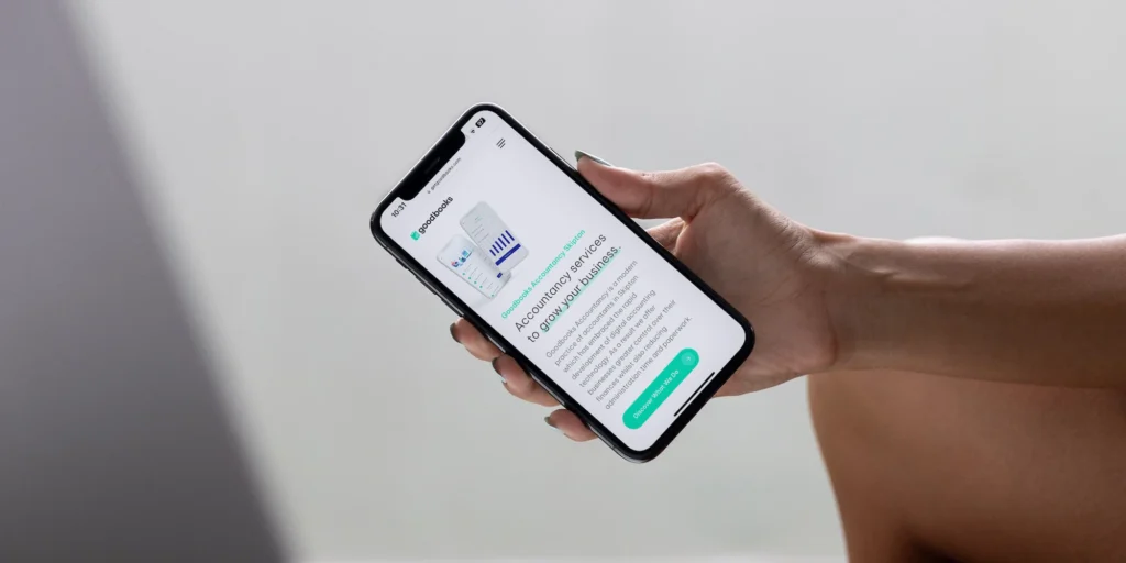 Mobile-friendly website for Skipton accountancy firm displayed on iPhone – responsive web design by Shrewsbury-based designer. Cropped slim.