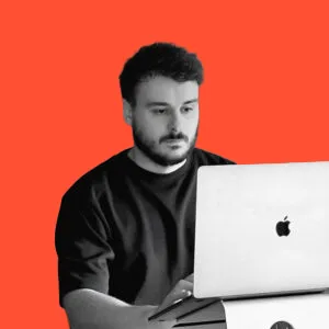 David Payne profile photo with orange background – Studio Payne founder, Shrewsbury graphic designer