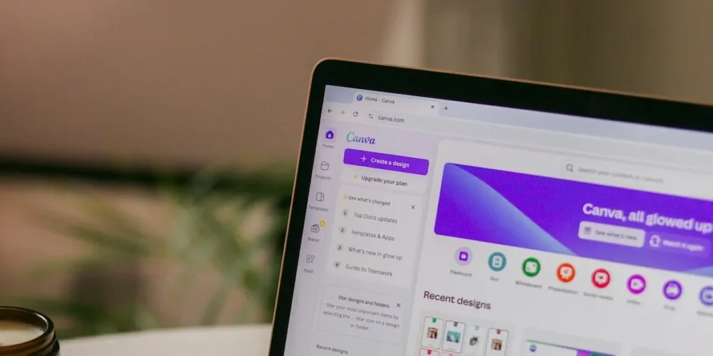 Close-up of laptop screen corner showing Canva graphic design interface